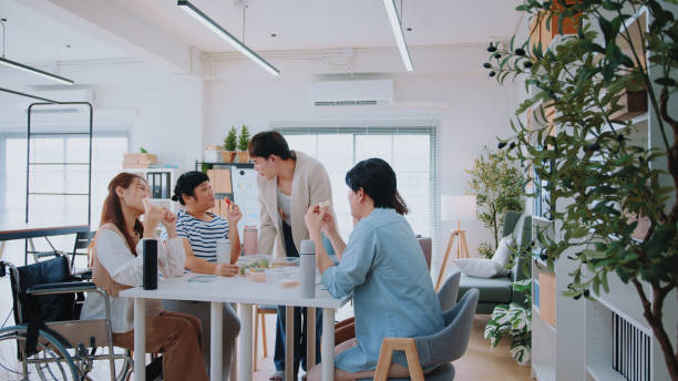 istock Unity in Diversity: Colleagues Create Joyful Memories During Lunchtime at the Office 1967865380