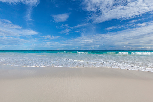 white sand beach and indian ocean, seychelles.