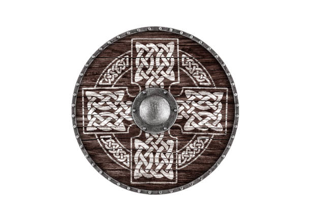 istock Old decorated wooden round shield isolated on white background 1967918252