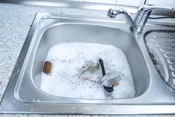 istock Sink filled with water, dirty dishes and foam 1967919290