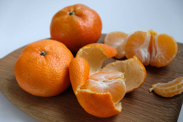 istock tangerines on a cutting board in front of the window 1967924587