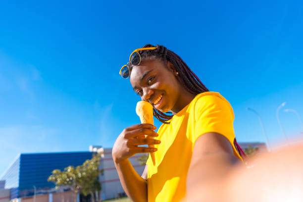 istock Cool african woman taking a selfie with an ice cream 1967929287