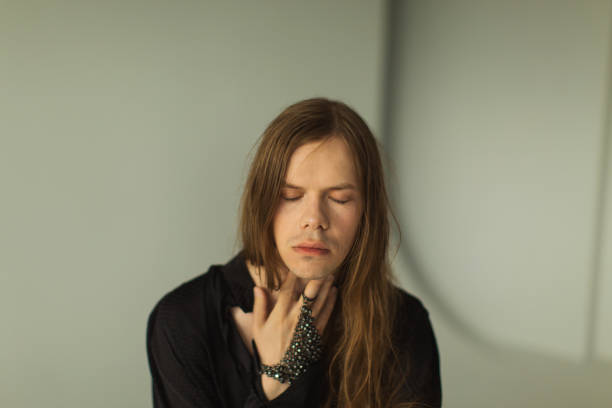 Long hair man in studio.