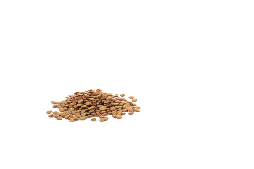 Heap of lentils isolated on a white background