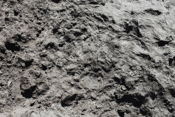 istock Black volcanic rock texture. Basalt background. Tenerife island. Closeup geology pattern. 1967978995