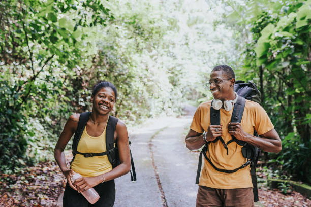 istock Friends walking in the forest park 1967987860