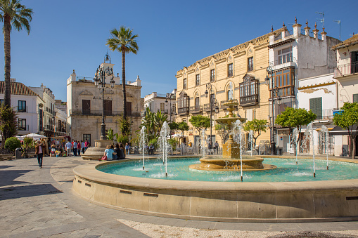 View of the fountain in the Plaza del Cabildo, in the historic center of the Andalusian city of Sanlucar de Barrameda, Spain