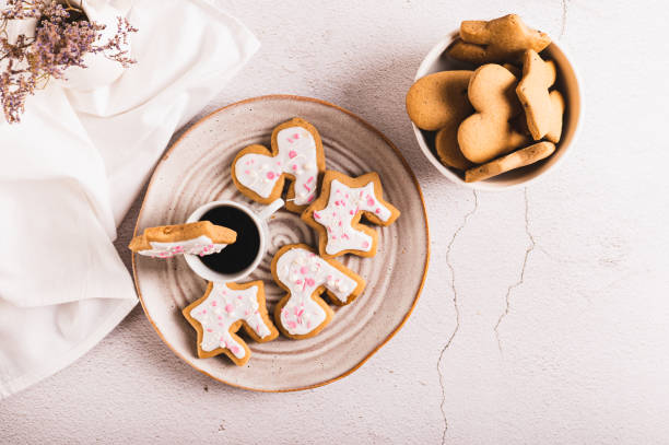 istock Homemade cookies hugging a coffee mug on a plate on the table top view 1967997326