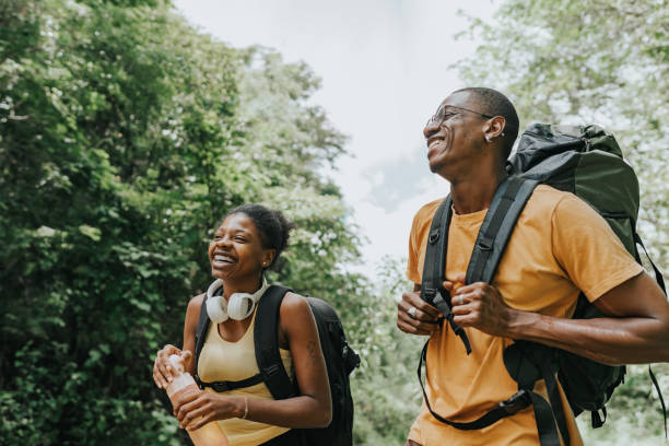 istock Backpacker couple strolling in the natural park 1968006837