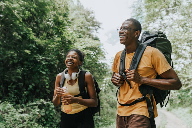 istock Backpacker couple strolling in the natural park 1968007897