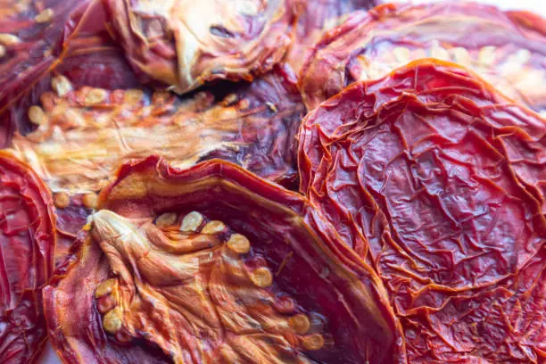 Background with dried tomatoes. Close-up.