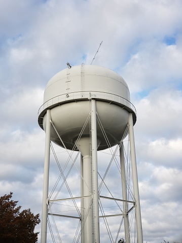 Water tank against a cloudy sky