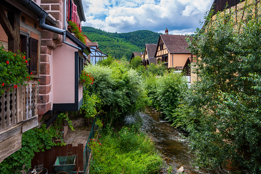 Traditional half-timbered houses and the River Weiss in the village of Kayserberg in Alsace, France, Vosges, Mountain