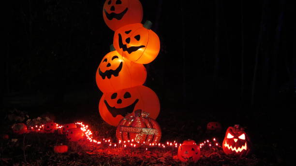 istock Halloween stacked pumpkins at night 1968029999
