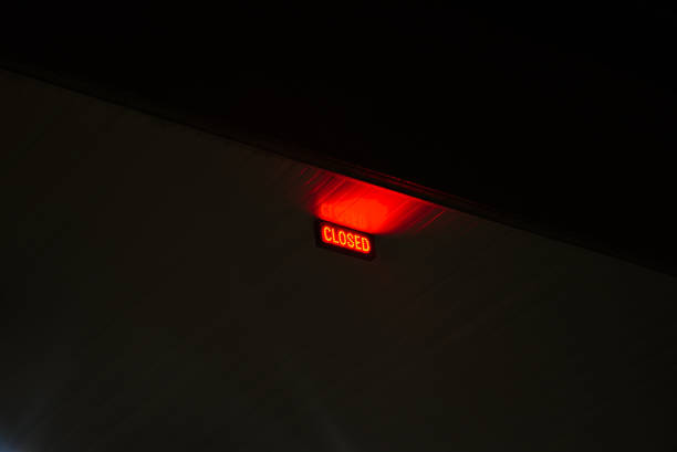 istock Red LED closed sign in the dark 1968030539