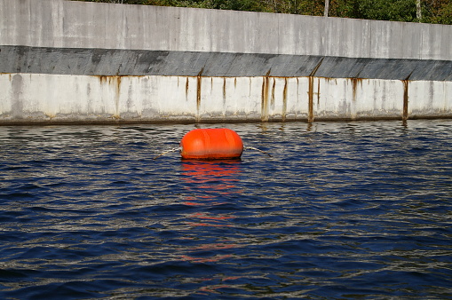 Close up of warning marker on a lake