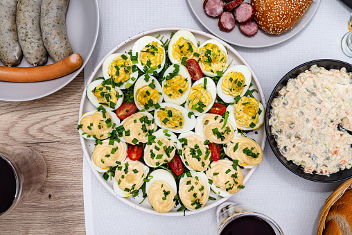 Traditional dishes from Poland for Easter breakfast, visible eggs with mayonnaise and stuffing.