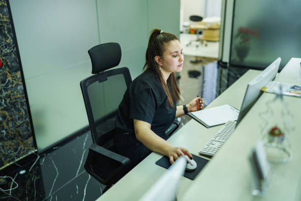 istock Healthcare Worker working on front desk at Clinic 1968126776