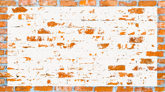 A weathered brick wall with a sizeable empty message