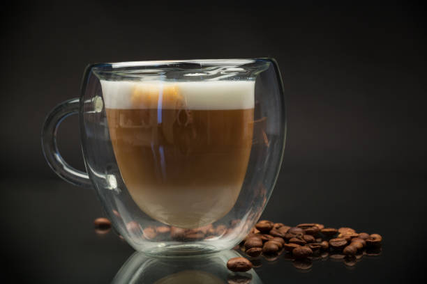 istock hot coffee with milk on black background 1968157550