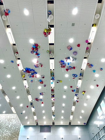 Miami, Florida, USA - January 5, 2024: A lot of Welcome's Balloons at Miami International Airport's ceiling.