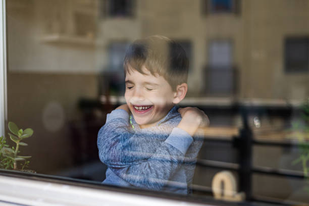 istock Smiling loving young boy hugging oneself 1968176012