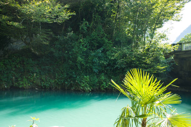 istock blue lake in Abkhazia 1968229903