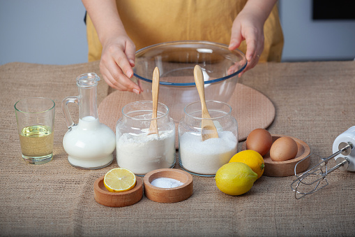 Mixing flour and eggs, making lemon cake