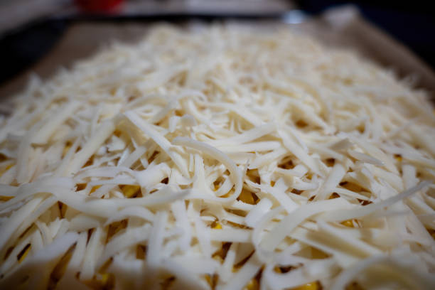istock Close-up of a raw pizza with chees. 1968256050