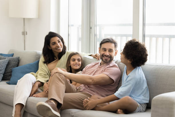 istock Happy mom and dad talking to son and daughter 1968274185