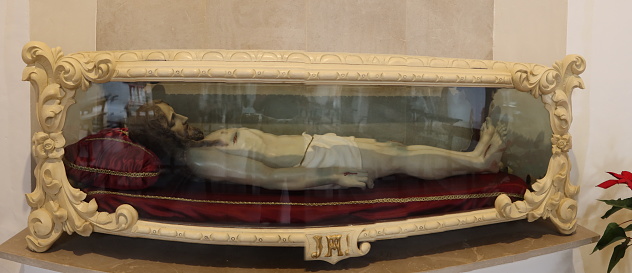Busot, Alicante, Spain, January 28, 2024: Image of Jesus Christ recumbent in the San Lorenzo Martir Church, 16th century. Busot, Alicante, Spain