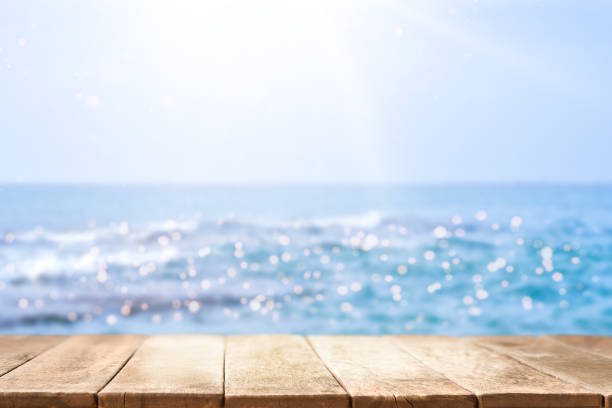 istock Empty wooden table with beautiful Sea on background 1968335872