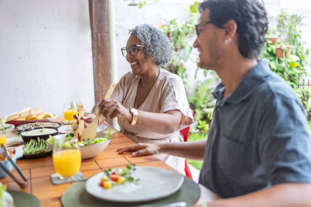 istock Mother and son happy at dinner on a holiday 1968356834
