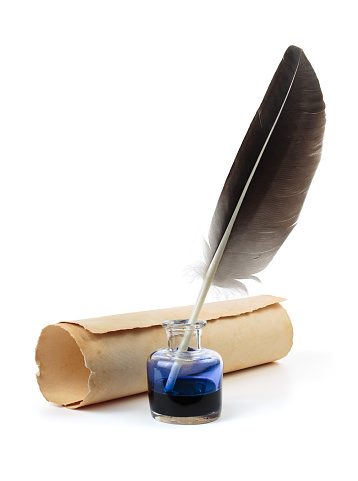 Quill pen with parchment and inkwell isolated on a white background