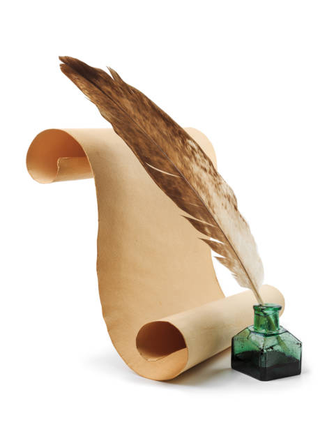 istock Ancient paper scroll with feather and ink bottle isolated on a white background 1968376241