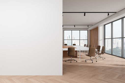 Stylish business interior with chairs and table, hardwood floor. Stylish meeting or workplace with panoramic window on Singapore skyscrapers. Mockup empty blank partition. 3D rendering