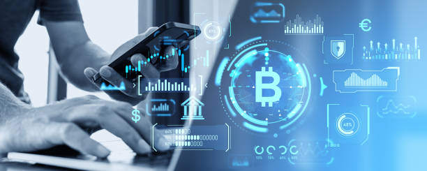 istock Man with phone and laptop, bitcoin interface 1968383007