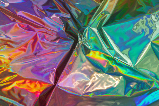 istock Trendy holographic background. Iridescent foil texture. Metallic backdrop 1968410979