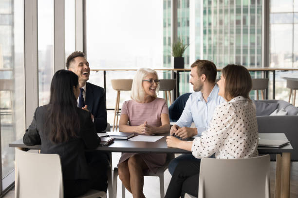 istock Happy senior boss woman brainstorming on creative ideas with colleagues 1968435513