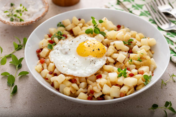 istock Potato hash with pancetta topped with a fried egg 1968520254