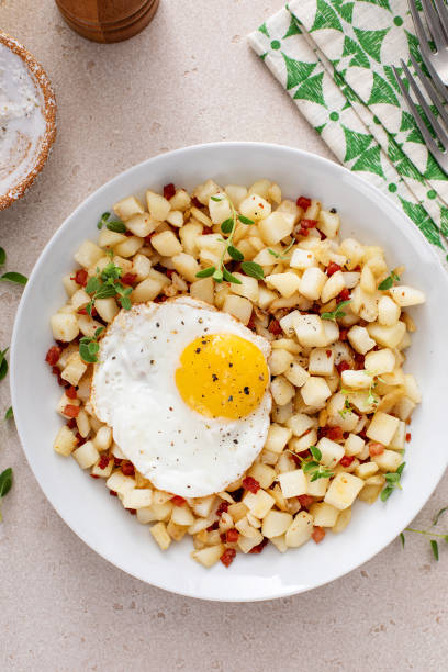 istock Potato hash with pancetta topped with a fried egg 1968520352