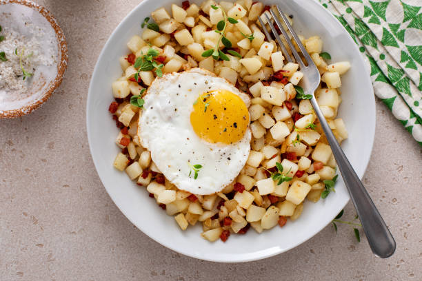 istock Potato hash with pancetta topped with a fried egg 1968520764