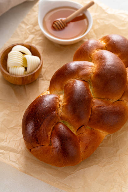 istock Freshly baked hallah with butter and honey 1968520806