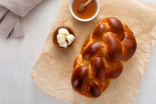istock Freshly baked hallah with butter and honey 1968520809