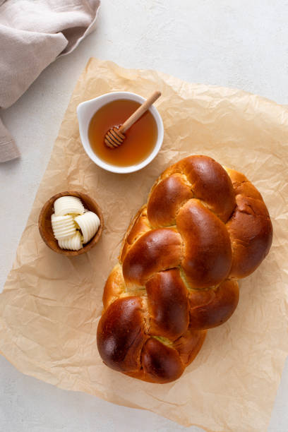 istock Freshly baked hallah with butter and honey 1968520813