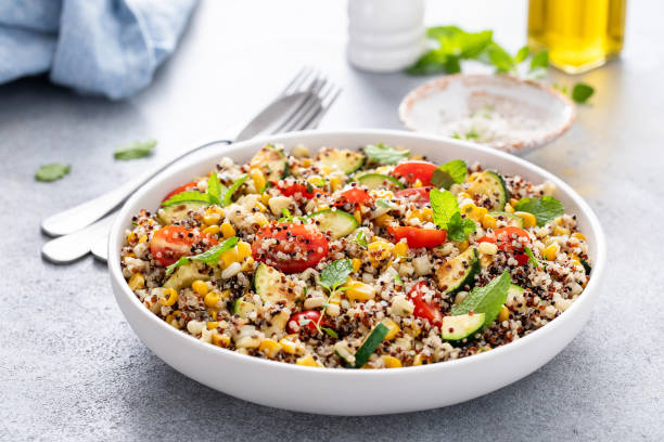 istock Warm quinoa salad with tomatoes, corn and zucchini 1968521350