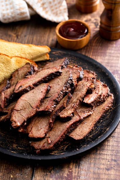 istock Sliced smoked brisket on a serving plate with toast 1968538031