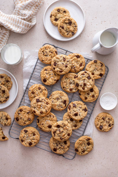 istock Chocolate chip cookies on a cooling rack with flaky salt served with milk 1968539114