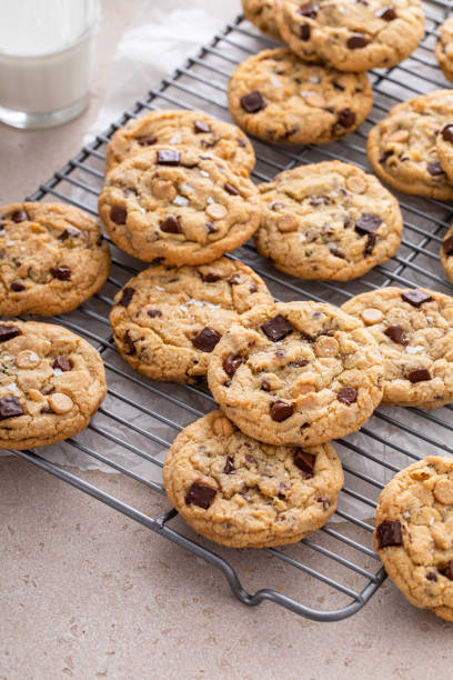 istock Chocolate chip cookies on a cooling rack with flaky salt served with milk 1968539115