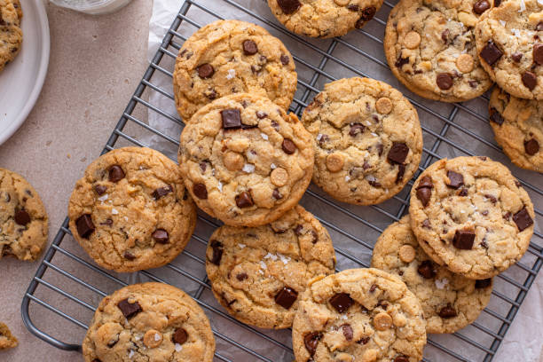 istock Chocolate chip cookies on a cooling rack with flaky salt served with milk 1968539517